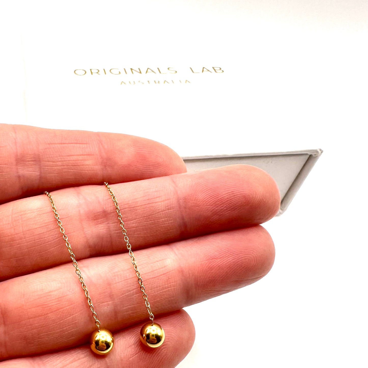 Minimalist ball end ear thread earrings in Gold