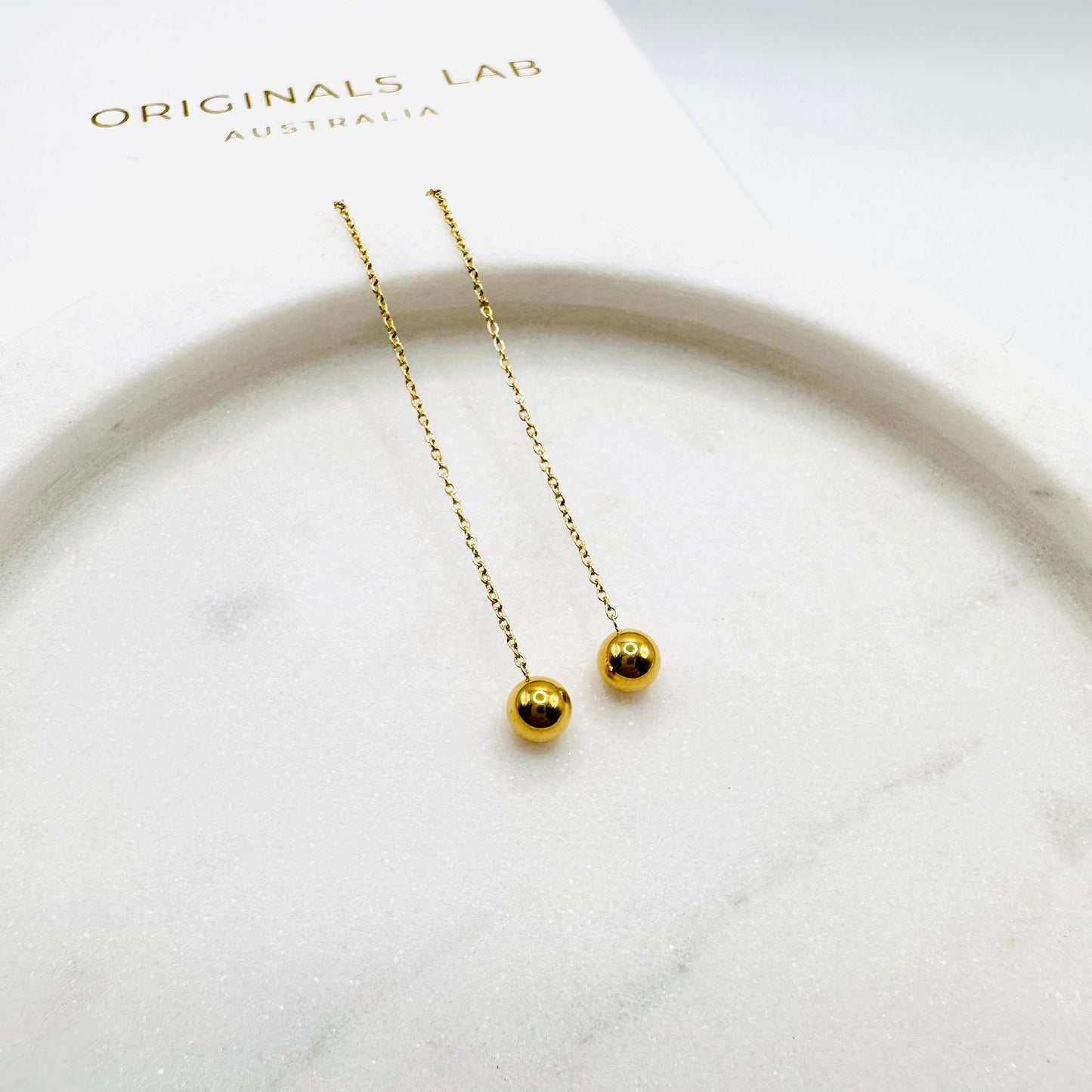 Minimalist ball end ear thread earrings in Gold