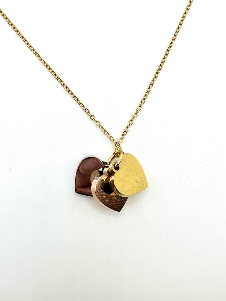 Dainty necklace with gold, silver and rose gold hearts