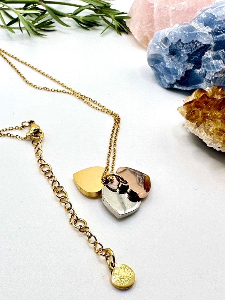 Dainty necklace with gold, silver and rose gold hearts