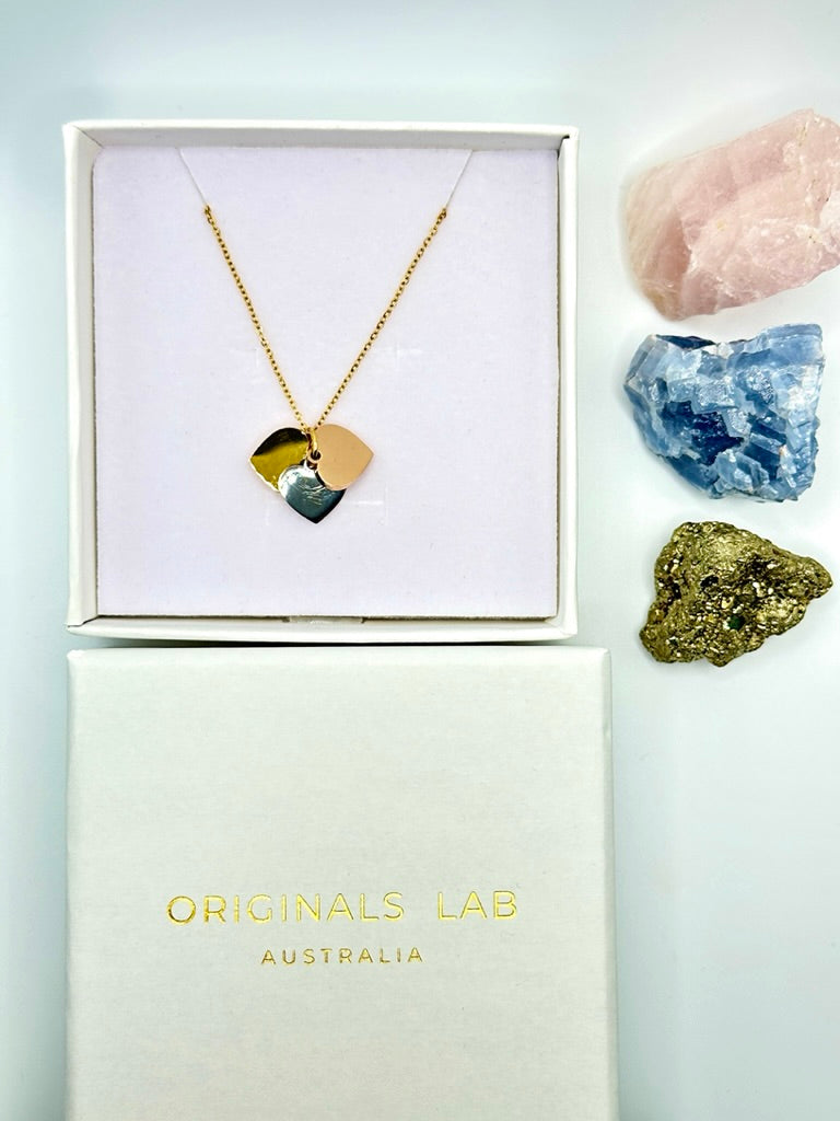 Dainty necklace with gold, silver and rose gold hearts