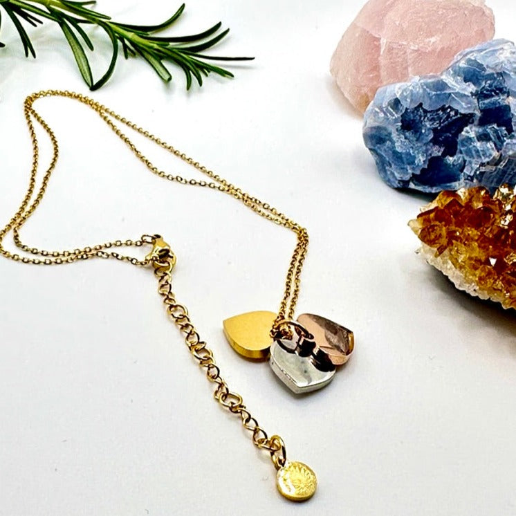 Dainty necklace with gold, silver and rose gold hearts