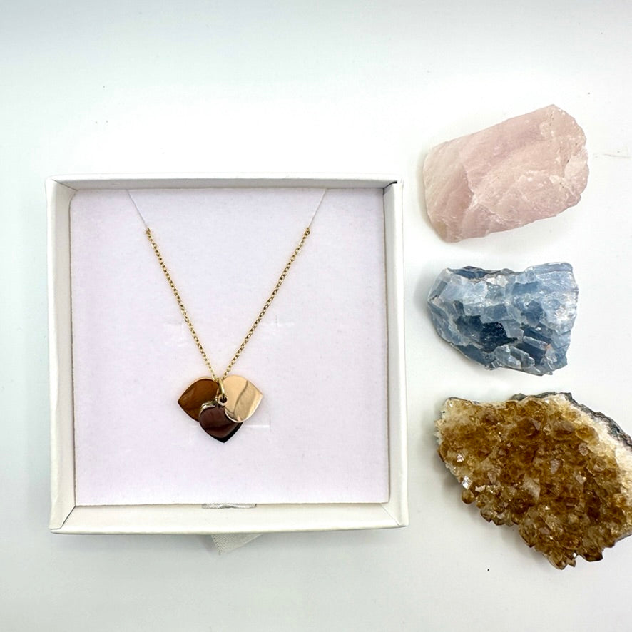 Dainty necklace with gold, silver and rose gold hearts